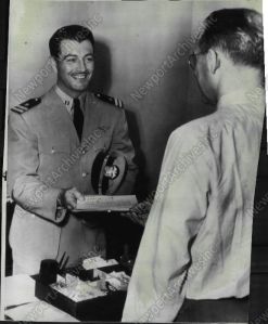 Robert Taylor receiving his discharge papers from the Navy.
