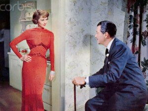 1958 --- American actors Cyd Charisse and Robert Taylor on the set of Party Girl, directed by Nicholas Ray. --- Image by © Sunset Boulevard/Corbis