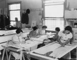 circa 1936: Seamstresses at work cutting and sewing a dress to be worn by actress Greta Garbo in the film 'Camille'. (Photo by Hulton Archive/Getty Images)