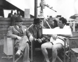 Director Jack Conway & producer Michael Balcon with Robert Taylor on the set of film "A Yank at Oxford" filming in England.