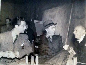 Rt and Edmund Gwenn, seen here with Director Jack Conway, discussing a scene of MGM British Studios' "AYaO," in which Maureen O'Sullivan and Lionel have leading roles.