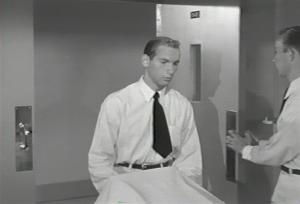 Ralph Moratz pushing a stretcher in "Not as a Stranger."